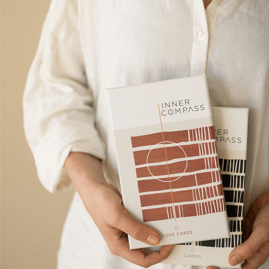 Neel van Lierop holds the Inner Compass Original and Love cards