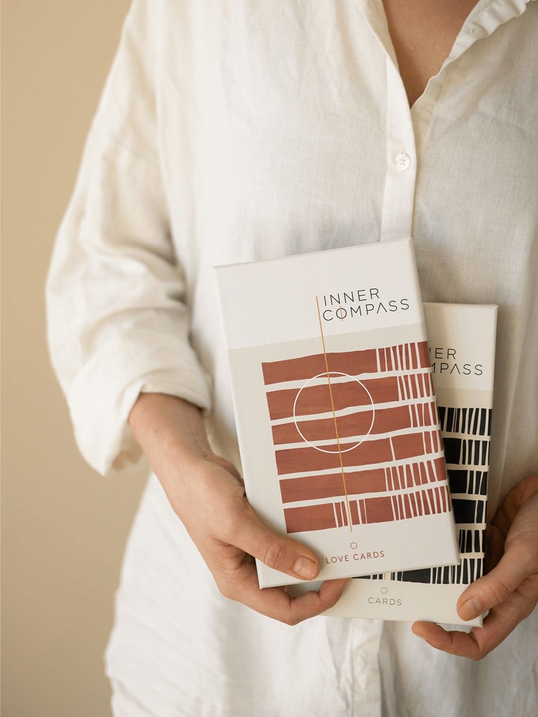 Neel van Lierop holds the Inner Compass Original and Love cards