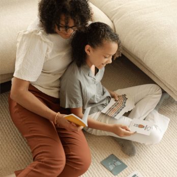 A mother and her child doing a card reading together